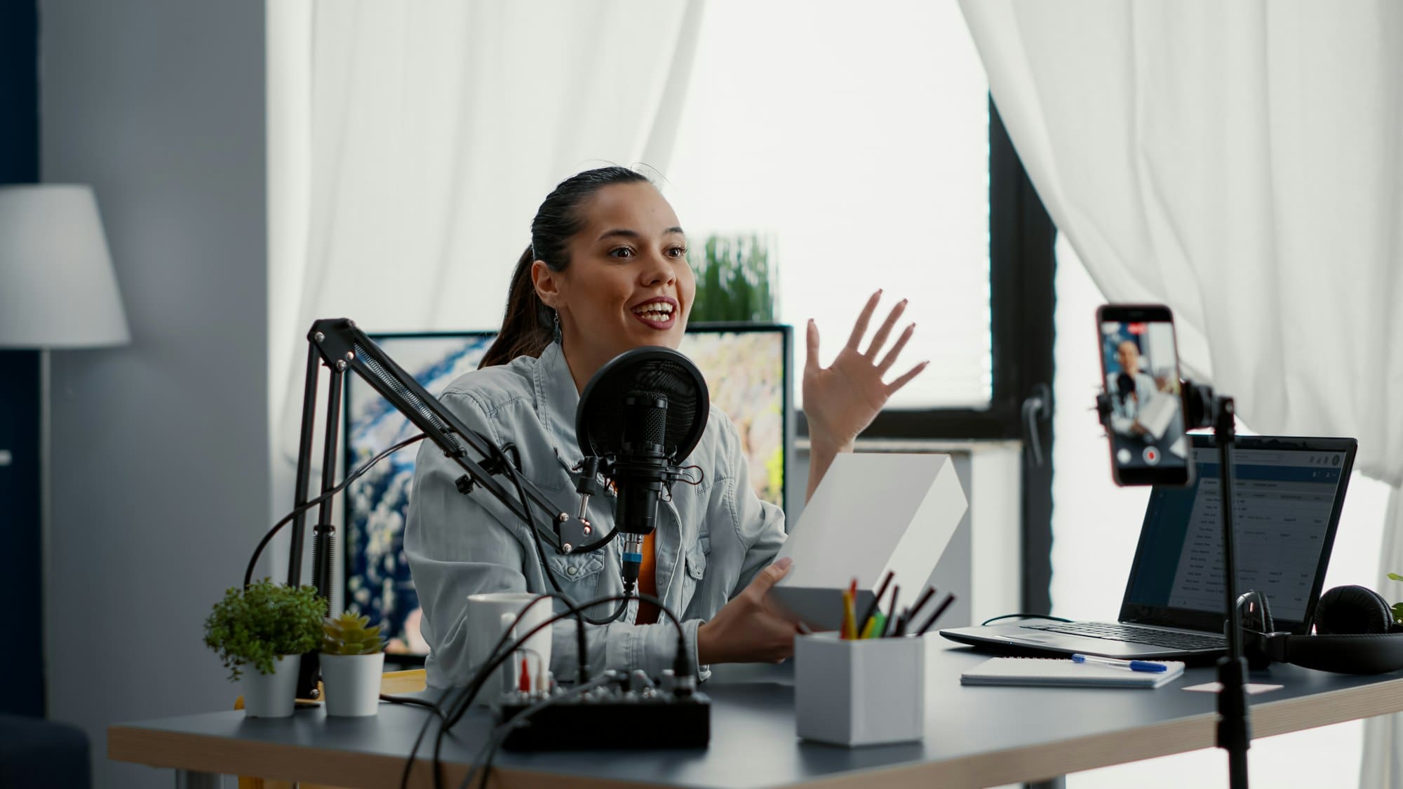 Digital content creator unpacking and reviewing electronic product to audience