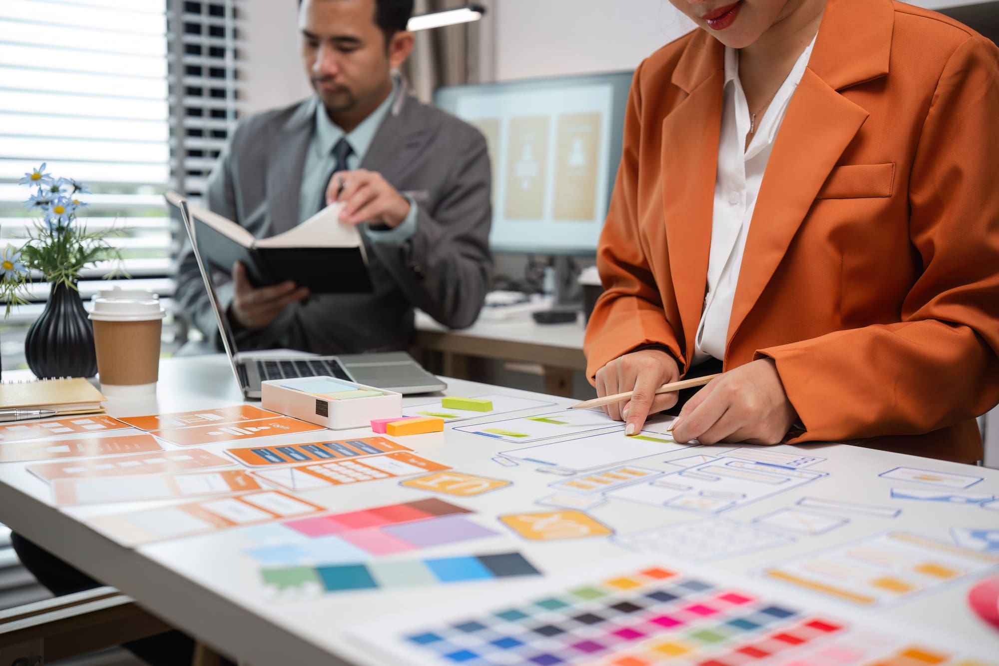 Program Developer Team Collaborates on UXUI Design in Modern Office Setting